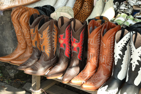 Bali, Indonesia - May 25, 2025: Different shoes on display at outdoor market, closeupの写真素材