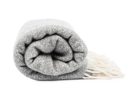 Folded gray woolen blanket isolated on whiteの写真素材