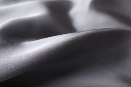 Crumpled gray silk fabric as background, closeupの写真素材