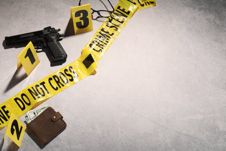 Forensic expertise. Crime scene with evidence, markers and police tape on light gray background,...