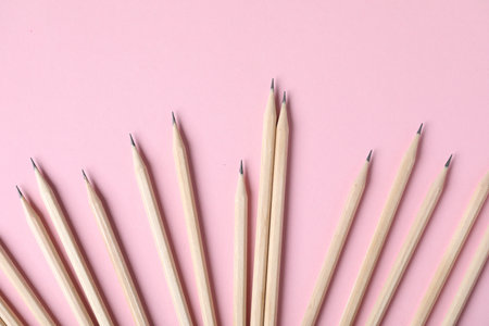 Many graphite pencils on pink background, flat layの写真素材