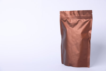 One zipper stand-up pouch on light gray background. Mockup for designの写真素材