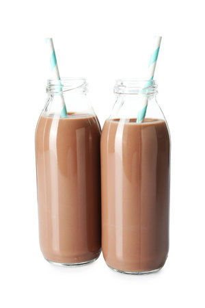 Tasty chocolate milk in glass bottles isolated on whiteの写真素材