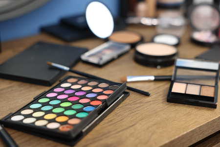 Different makeup products on wooden table indoors, closeupの写真素材