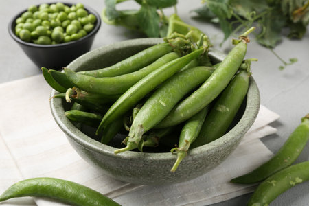 Fresh ripe green peas on grey table, closeupの写真素材