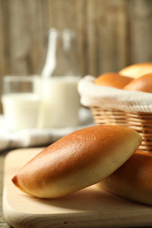 Tasty baked patties on wooden table, closeup. Space for textの写真素材