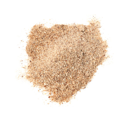 Pile of nutmeg powder isolated on white, above viewの写真素材