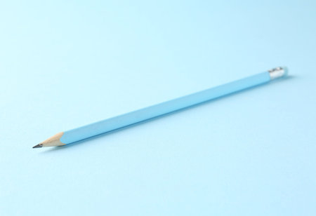 One graphite pencil on light blue background, closeupの写真素材