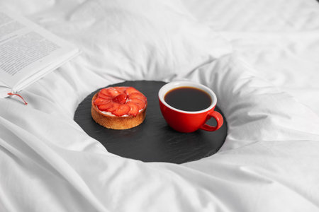 Tray with delicious breakfast on bed indoors, closeupの写真素材