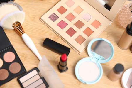 Different makeup products on wooden vanity, above viewの写真素材