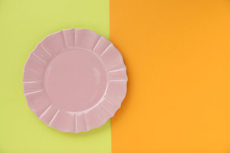 Empty plate on color background, top view. Space for textの写真素材