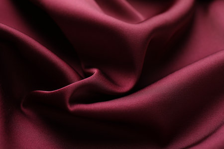 Crumpled burgundy silk fabric as background, closeupの写真素材