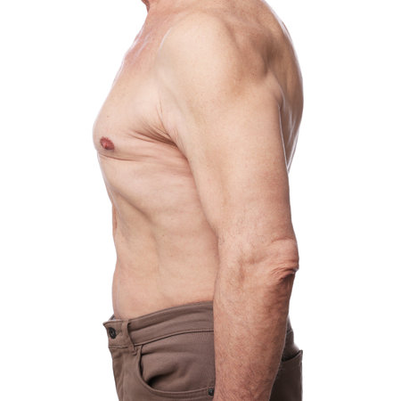 Senior man with good posture on white background, closeupの写真素材