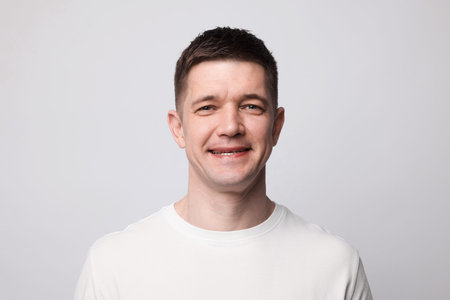 Portrait of handsome man on light background