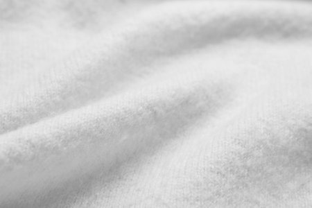 Texture of white fabric as background, closeup