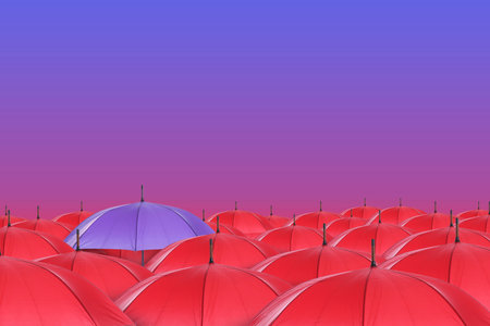 Violet umbrella among red ones against color gradient backgroundの写真素材