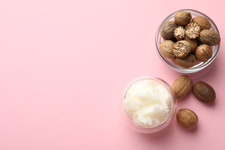 Natural shea butter on pink background, flat lay. Space for textの写真素材