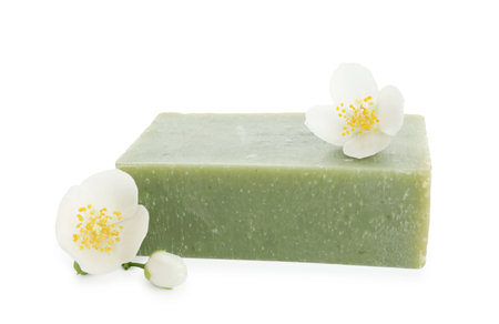 Soap bar and jasmine flowers isolated on whiteの写真素材