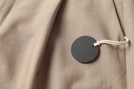 Cardboard tag on beige pants, above viewの写真素材