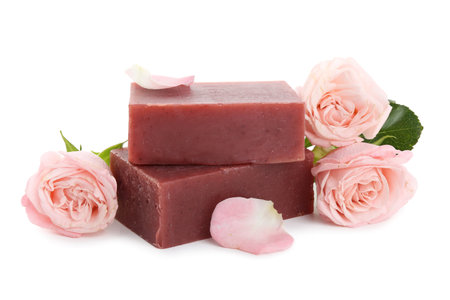 Aromatic soap bars and roses isolated on whiteの写真素材