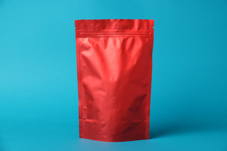 One zipper stand-up pouch on light blue background. Mockup for design