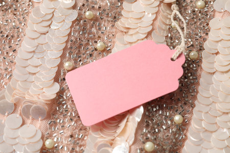 Cardboard tag on garment pink, above viewの写真素材