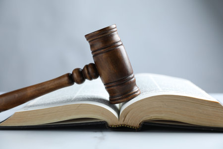 Judge's gavel and Bible on white marble table, closeupの写真素材