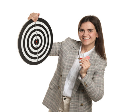 Targeting. Smiling businesswoman with dart board and arrow on white backgroundの写真素材