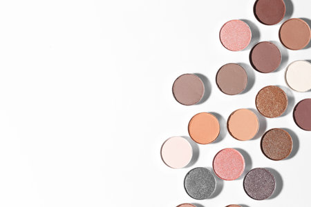 Beautiful eyeshadow refill pans on white background, flat lay. Space for textの写真素材