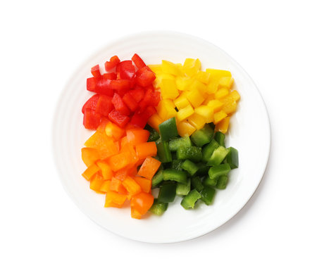 Cut colorful bell peppers isolated on white, top viewの写真素材