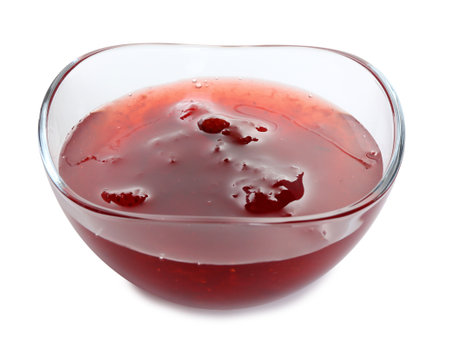 Tasty strawberry jam in glass bowl isolated on whiteの写真素材