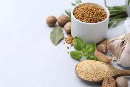Different aromatic spices on light grey table, closeup. Space for textの写真素材