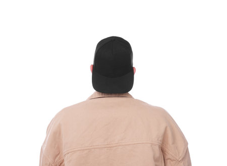 Young man wearing stylish black baseball hat on white background, back viewの写真素材