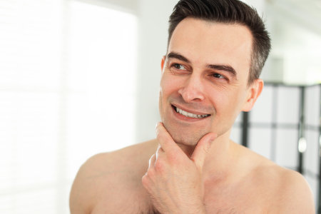 Smiling man after shaving at home, closeupの写真素材