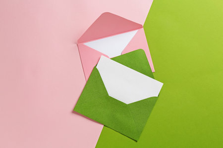 Blank invitation cards and envelopes on color background, flat layの写真素材