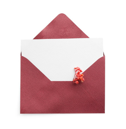 Blank invitation card and envelope with flower isolated on white, top view. Space for designの写真素材