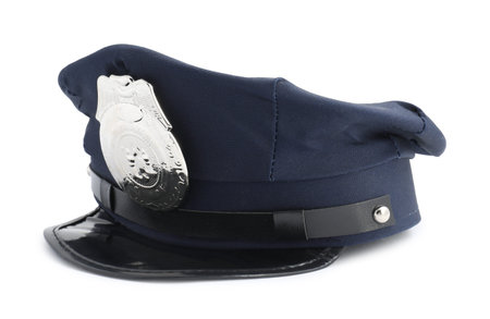 One dark blue police cap on white backgroundの写真素材