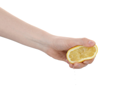 Woman squeezing lemon on white background, closeupの写真素材