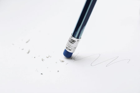 Using pencil with eraser on white background, closeup
