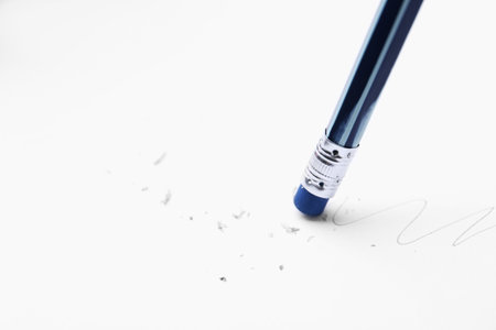 Using pencil with eraser on white background, closeup. Space for textの写真素材