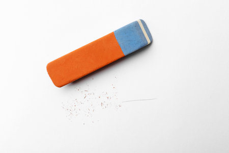 Eraser and scraps on white background, top viewの写真素材