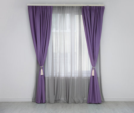 Window with purple curtains in room. Interior designの写真素材
