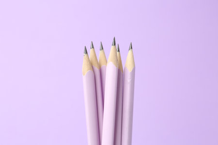 Many graphite pencils on violet background, closeupの写真素材