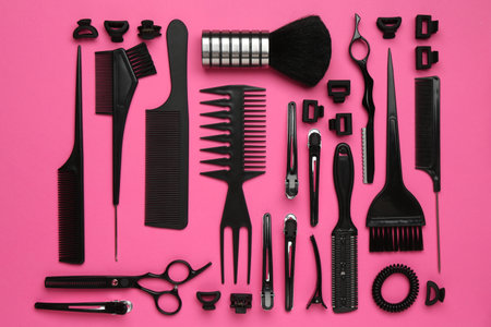 Different hairdresser's tools on pink background, flat layの写真素材