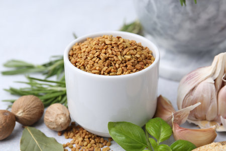 Different aromatic spices on light gray table, closeupの写真素材