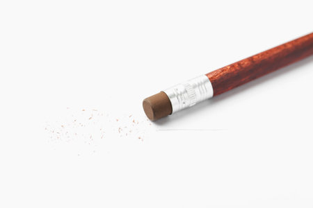 Pencil with eraser and scraps on white background, closeupの写真素材