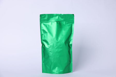 One zipper stand-up pouch on light gray background. Mockup for designの写真素材