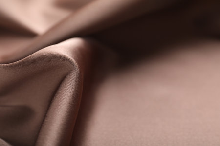 Crumpled light brown silk fabric as background, closeupの写真素材