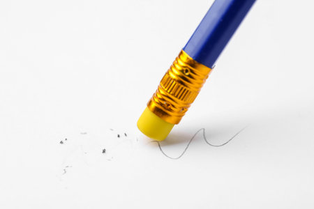 Using pencil with eraser on white background, closeupの写真素材