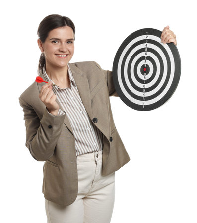 Targeting. Smiling businesswoman with dart board and arrow on white backgroundの写真素材